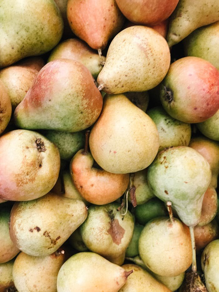 pexels photo 2067574 Close-up of fresh organic pears showcasing their natural vibrancy and texture.